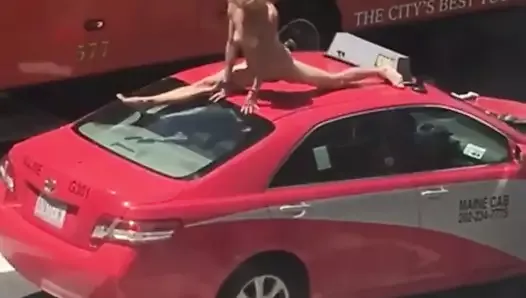 Woman dancing on a car in a busy street | xHamster